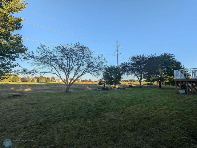 view of yard with a wooden deck