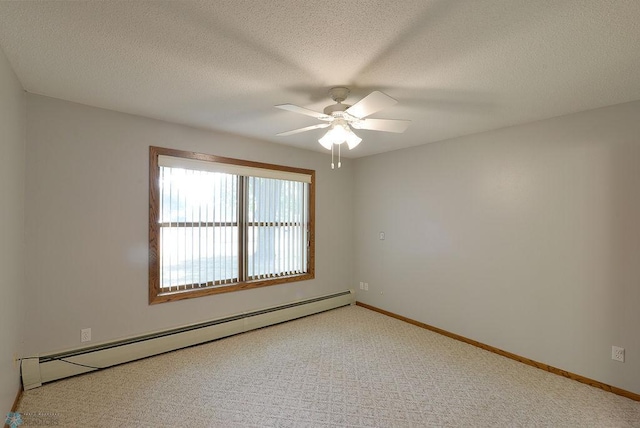 empty room featuring a baseboard radiator, ceiling fan, carpet floors, and a textured ceiling