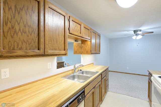 kitchen with ceiling fan, sink, dishwasher, light colored carpet, and white range