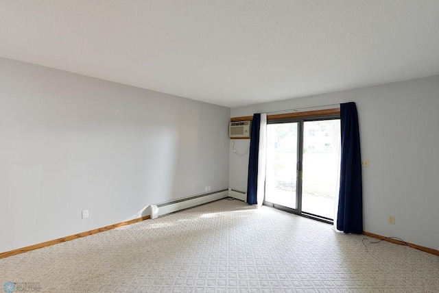 empty room featuring an AC wall unit and a baseboard radiator