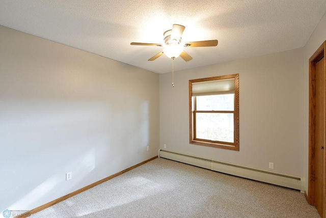 empty room with a textured ceiling, carpet flooring, ceiling fan, and a baseboard radiator