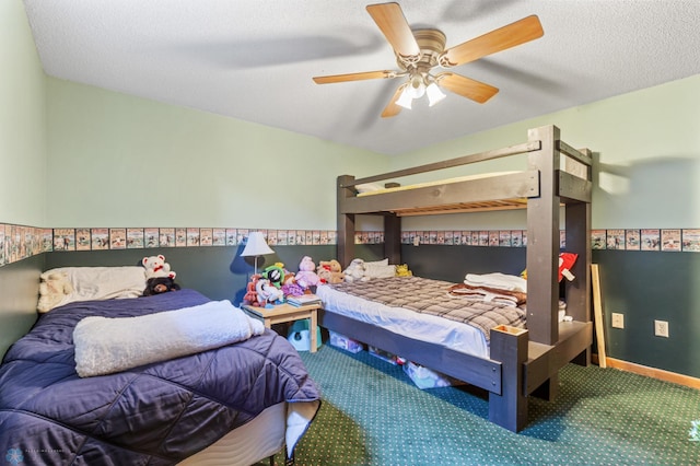 bedroom with carpet floors, a textured ceiling, and ceiling fan