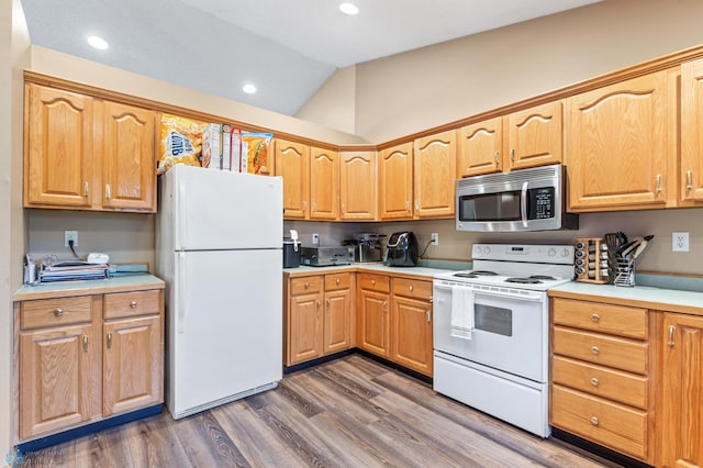 kitchen with white appliances, lofted ceiling, and dark hardwood / wood-style flooring