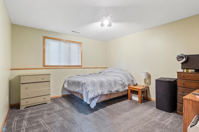 bedroom featuring dark carpet