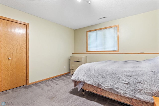 carpeted bedroom with a closet