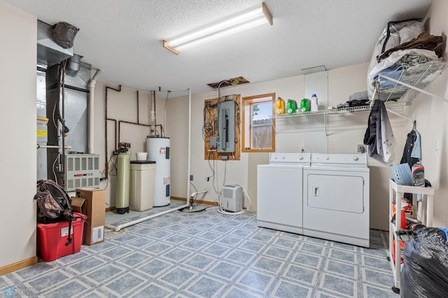 laundry area featuring electric water heater, separate washer and dryer, electric panel, and a textured ceiling