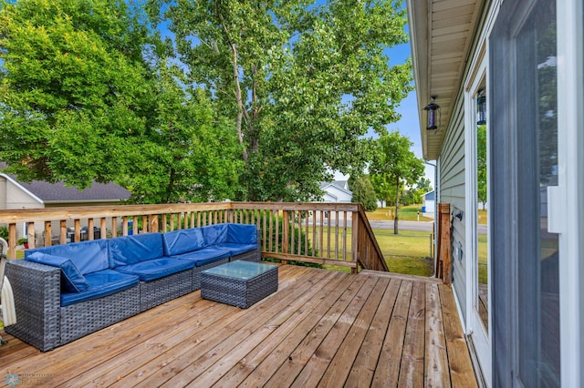 wooden terrace with an outdoor hangout area