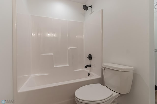 bathroom with toilet and shower / bathing tub combination