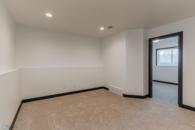 empty room with light colored carpet