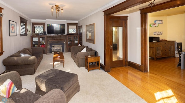 living room with ornamental molding and hardwood / wood-style floors