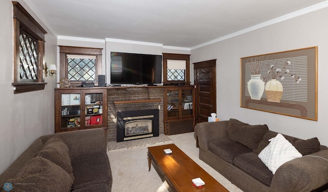 living room with crown molding, a fireplace, and light carpet