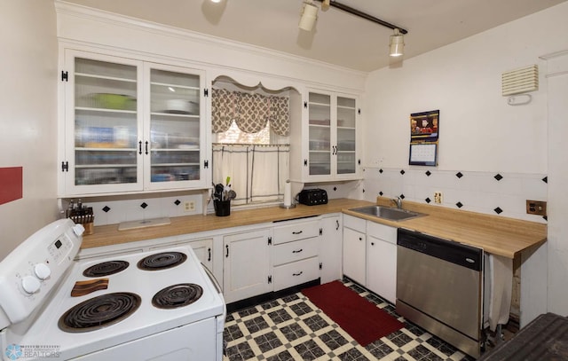 kitchen featuring white range with electric cooktop, sink, white cabinetry, and stainless steel dishwasher