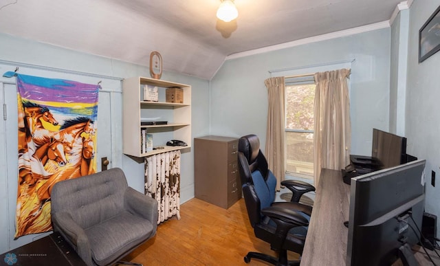 home office featuring lofted ceiling, light hardwood / wood-style floors, and crown molding