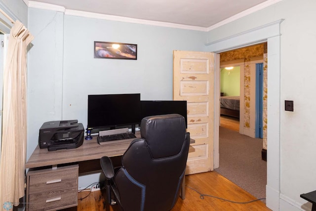 office space with wood-type flooring and crown molding