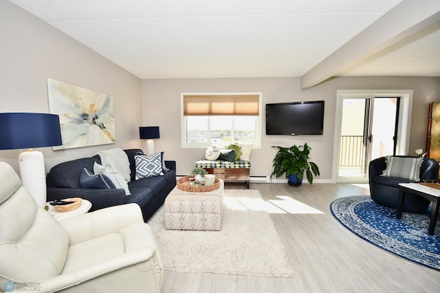 living room with wood-type flooring, baseboard heating, and beam ceiling