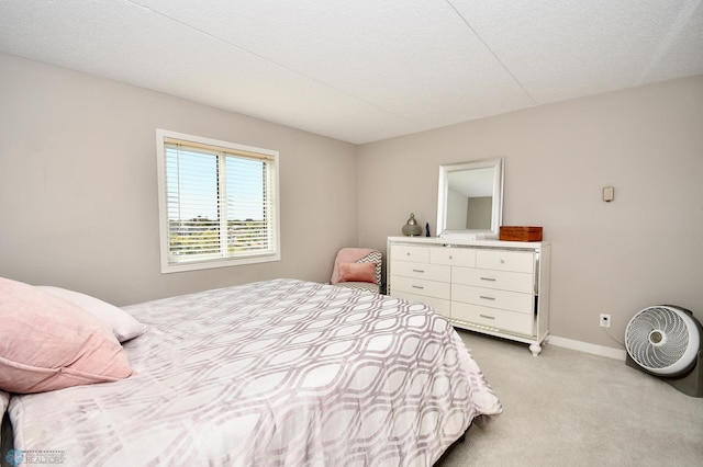 carpeted bedroom featuring a textured ceiling