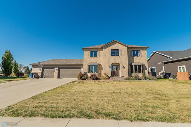 view of front facade with a front lawn and a garage