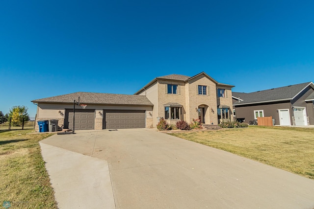 view of front of house featuring a front yard and a garage