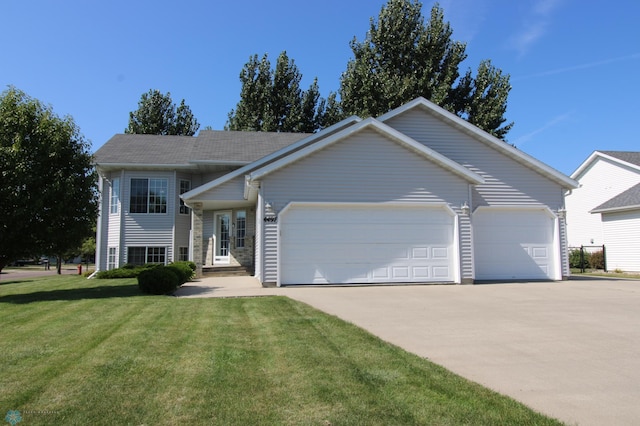 view of front facade featuring a garage and a front lawn