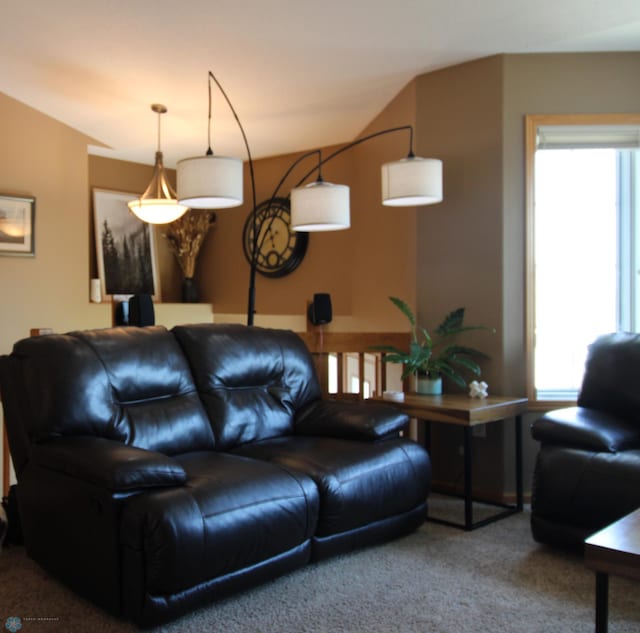 living room with carpet floors and a healthy amount of sunlight