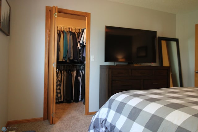 carpeted bedroom with a closet