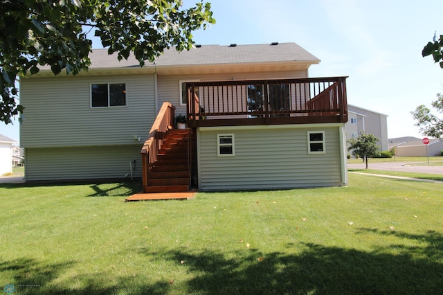 rear view of house featuring a lawn