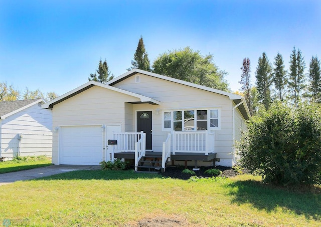 view of front of property with a garage and a front yard