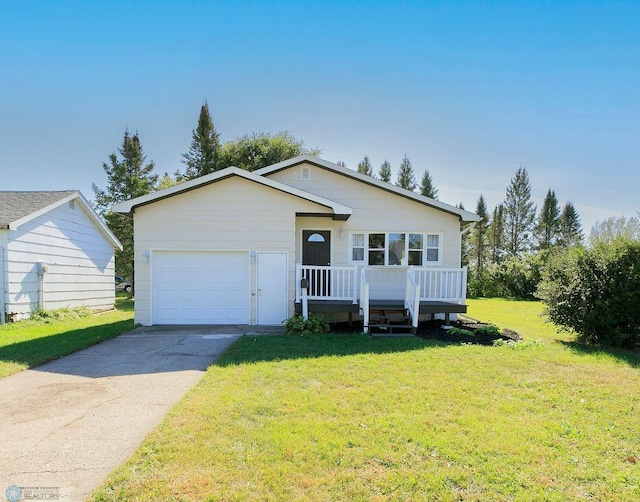 view of front of house with a front lawn and a garage