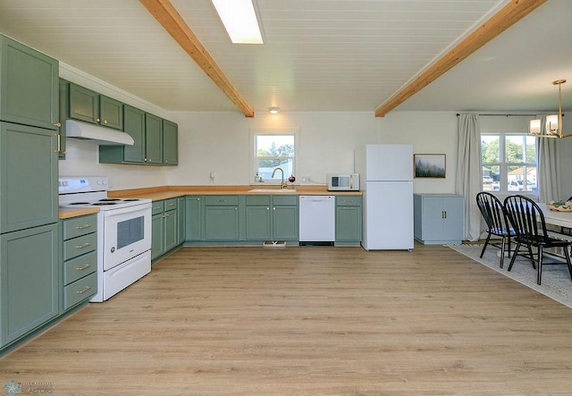 kitchen with white appliances, beam ceiling, green cabinets, and light hardwood / wood-style flooring