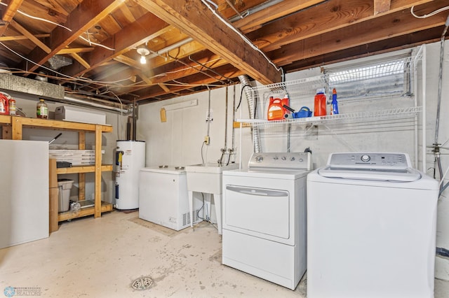 clothes washing area with water heater and washing machine and clothes dryer