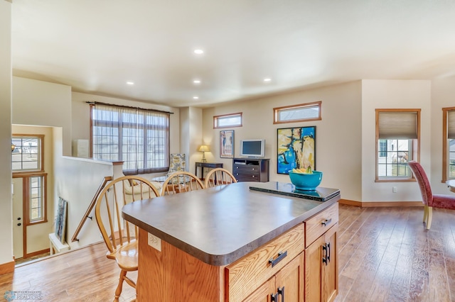 kitchen featuring light hardwood / wood-style floors and a kitchen island