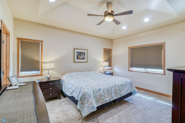 bedroom featuring ceiling fan and light carpet