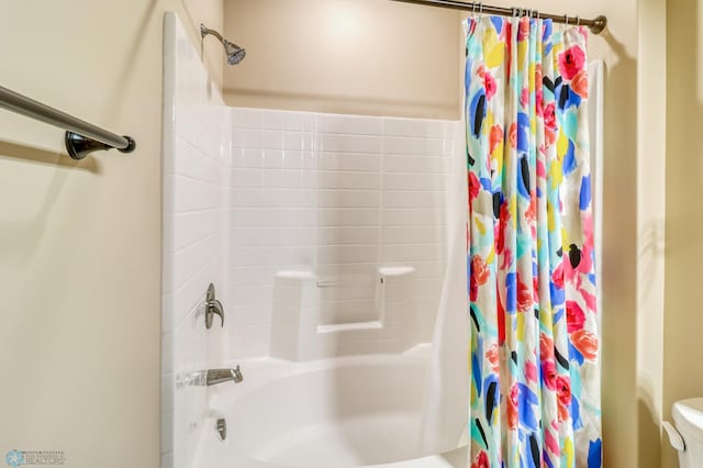 bathroom with toilet and shower / bath combination with curtain