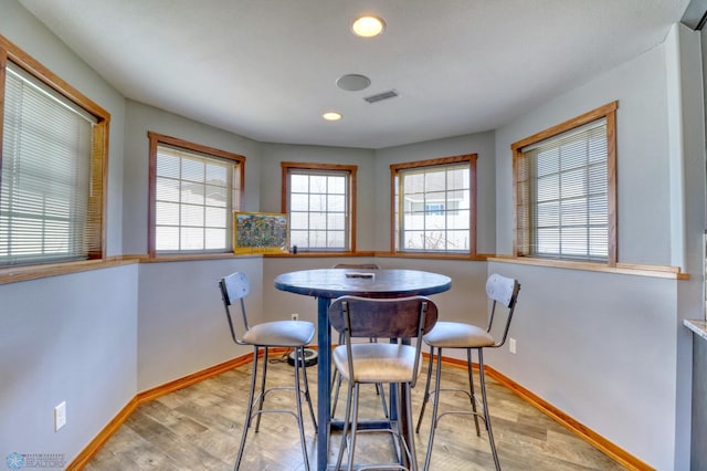 dining area with light hardwood / wood-style flooring