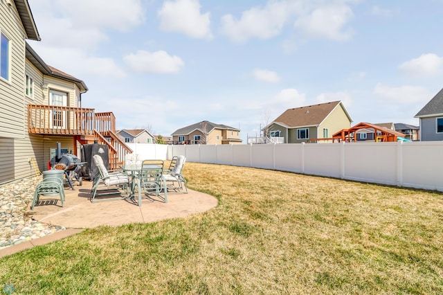 view of yard featuring a deck and a patio