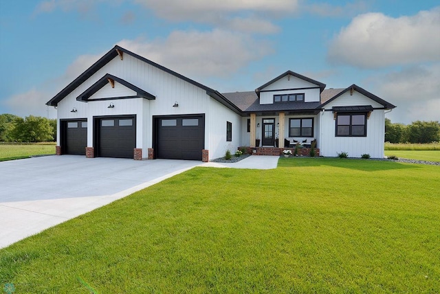 modern farmhouse with a garage and a front lawn