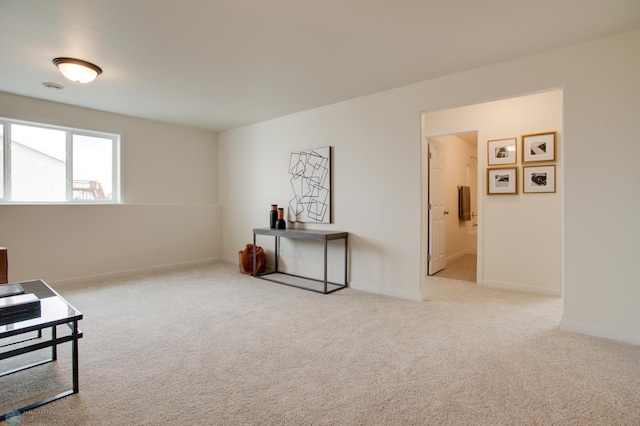 living area with light carpet