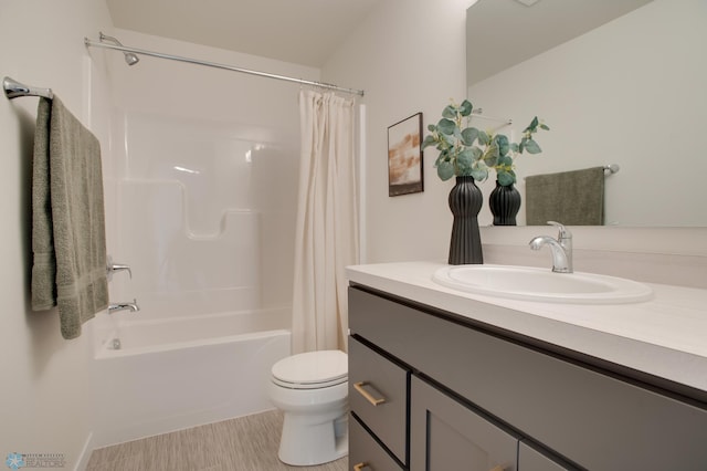 full bathroom with shower / bath combination with curtain, vanity, and toilet