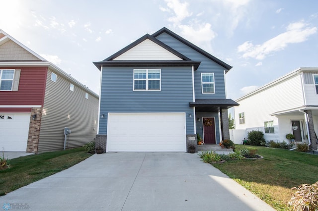 view of property featuring a front yard and a garage