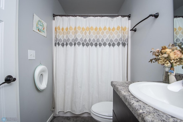 bathroom featuring vanity and toilet