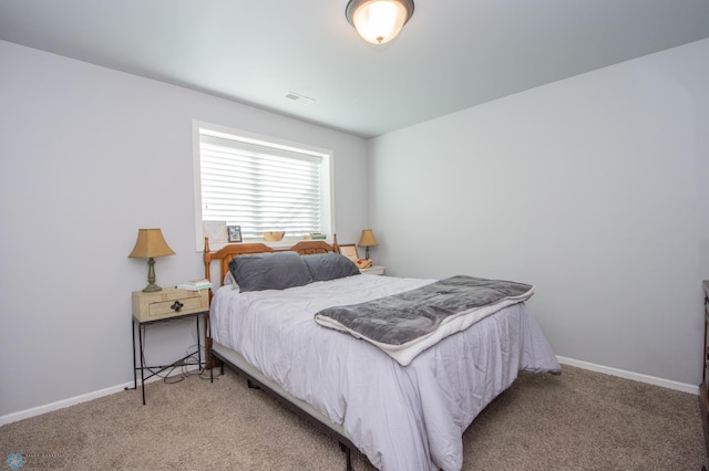 bedroom featuring light colored carpet