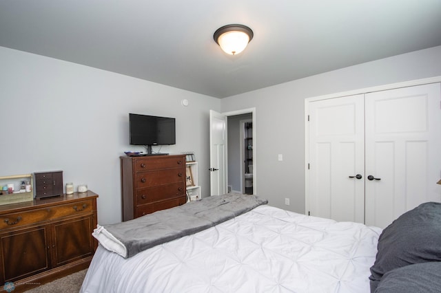 carpeted bedroom featuring a closet