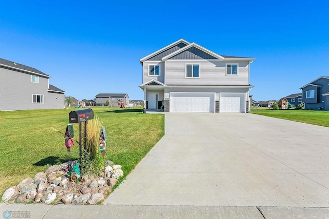 view of front of property featuring a front yard and a garage