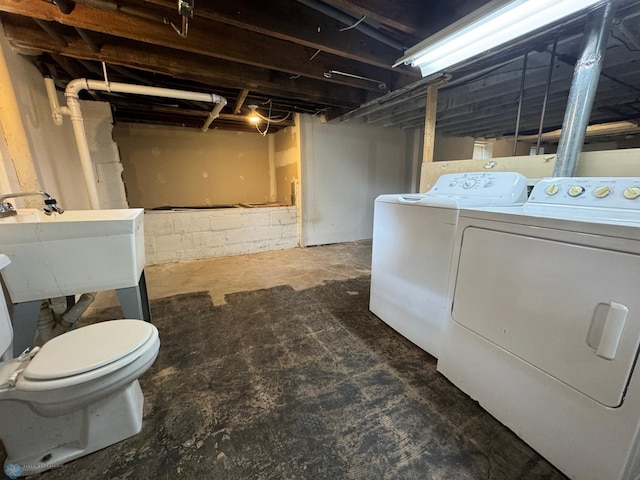 interior space featuring washer and clothes dryer and sink