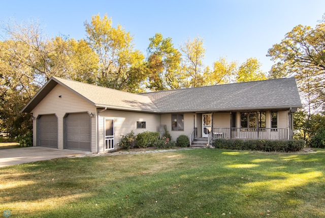 ranch-style house featuring a front lawn, a porch, and a garage