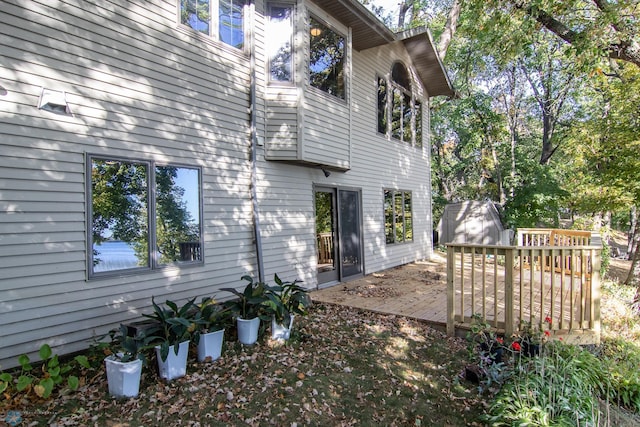 view of property exterior with a deck