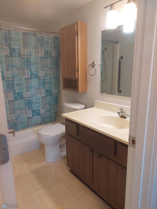 full bathroom featuring vanity, tile patterned flooring, toilet, and shower / bath combo