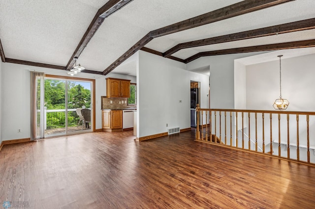 unfurnished living room featuring lofted ceiling with beams, an inviting chandelier, a textured ceiling, and dark wood-type flooring