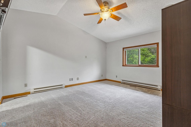 empty room featuring lofted ceiling, ceiling fan, baseboard heating, and a textured ceiling