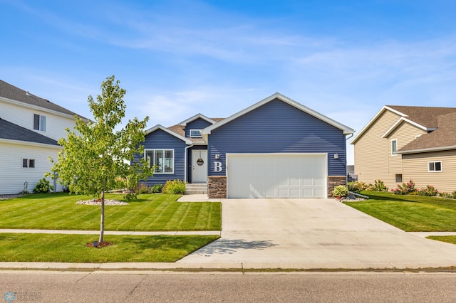 view of front of home with a garage and a front lawn